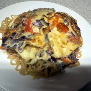 2 Indomie and Fried Egg with Enough Onions & Tomatoes